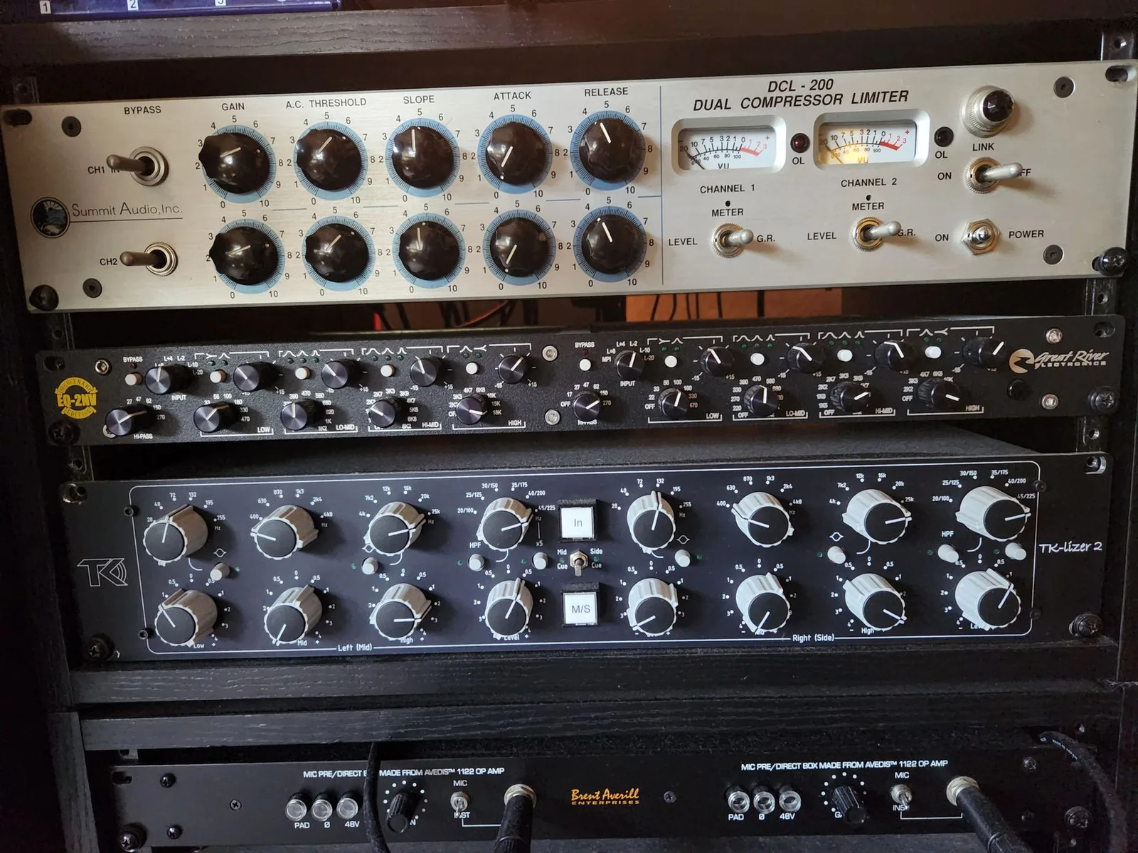 Photo of three rack-mounted units: a Summit Audio DCL-200 compressor on top, a Great River EQ-2NV Neve-style parametric equalizer, and a TK Audio TK-Lizer 2 below.